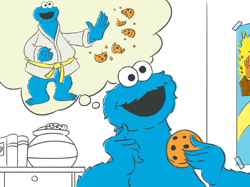 Cookie Monster thinking about karate chopping a cookie